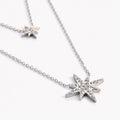 Collar doble de acero con estrellas.